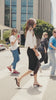 Model walking through NYC and styling her white tee,