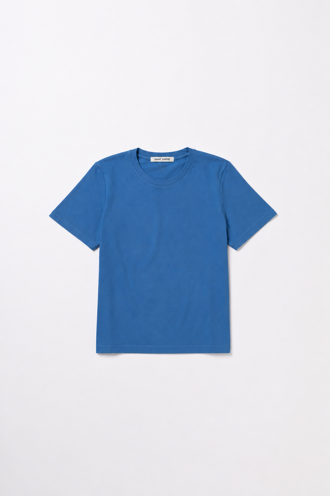 A classic short-sleeve crewneck t-shirt in a solid medium blue color, laid flat against a clean white background.